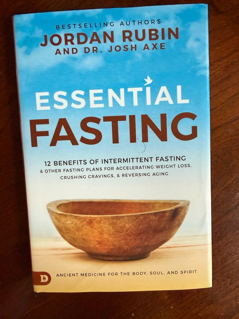 Essential Fasting by Jordan Rubin & Dr. Josh Axe - Blue and Brown Cover